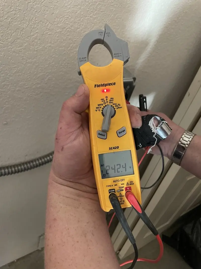 Voltage testing with clamp meter during Whole House Surge Protector in Unadilla